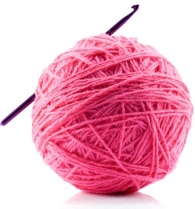 Pink ball of yarn with a crochet hook stuck in it